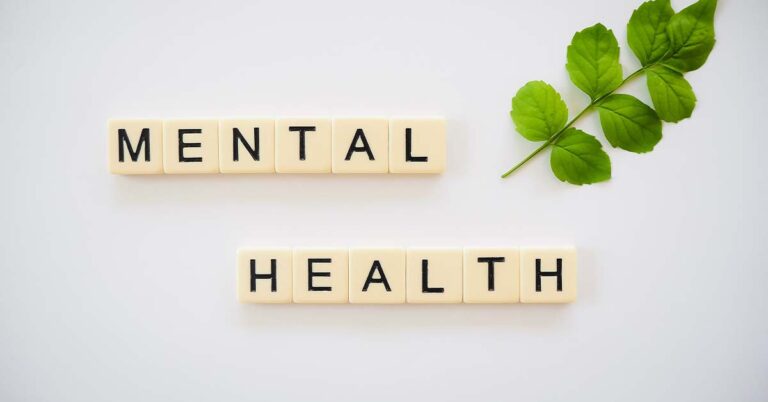 scrabble tiles spelling "mental health"