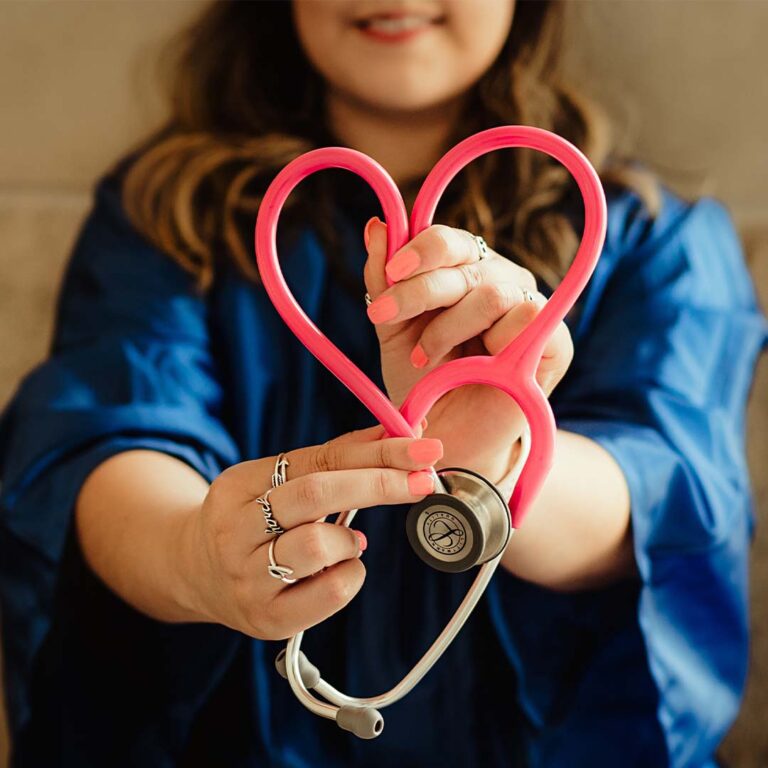 girl holding stethoscope