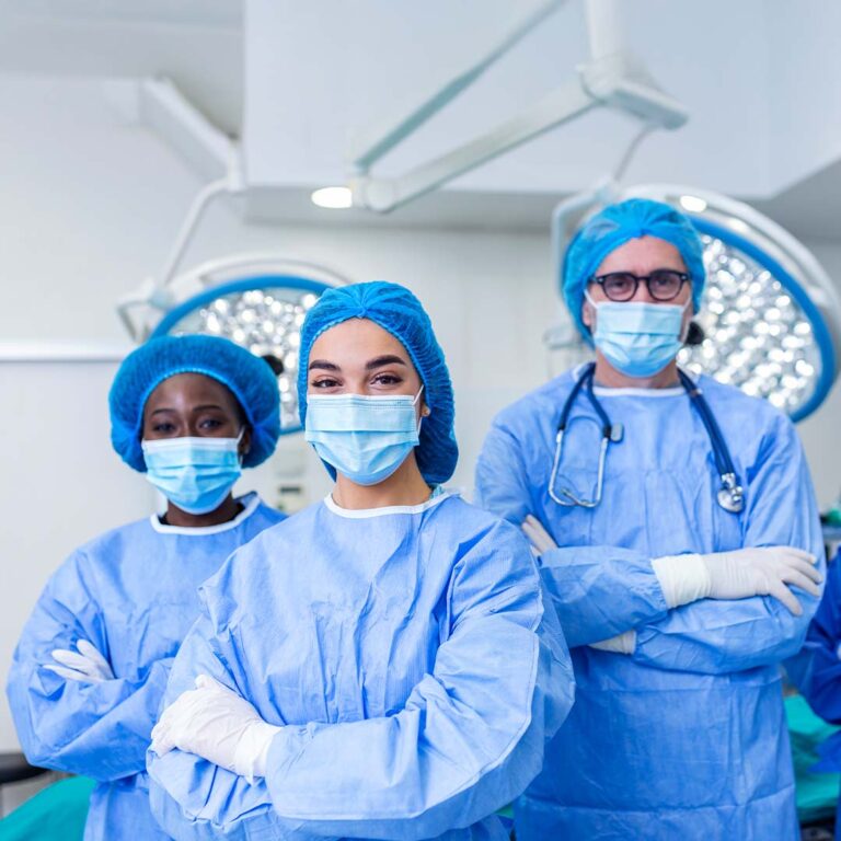Three anesthesiology doctors in an operating room.