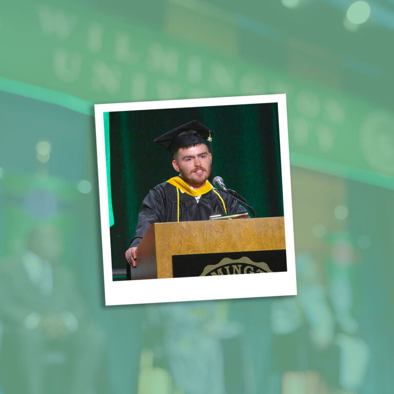 Nicholas Philips speaking at the 2025 Wilmington University commencement.