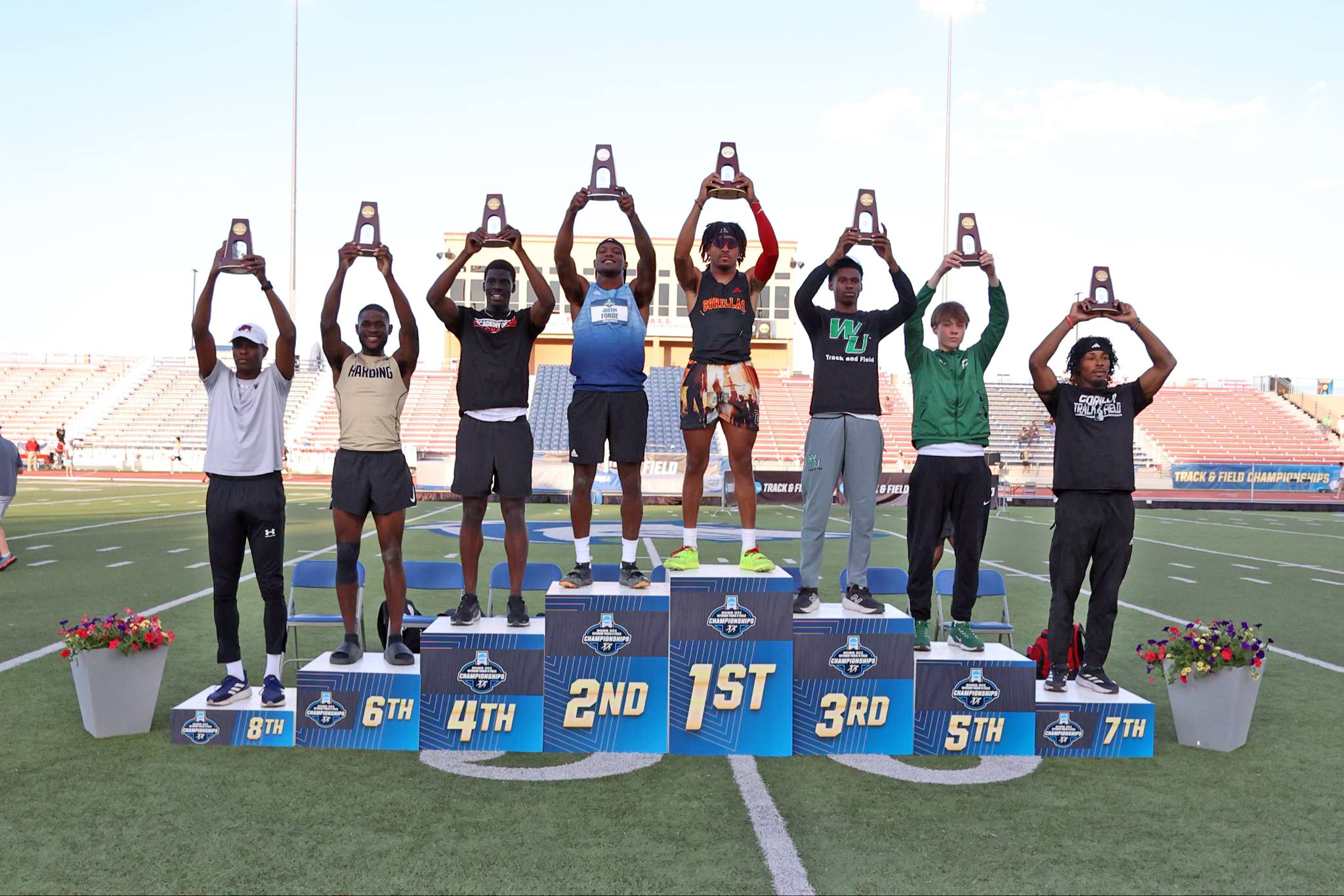 Donte Dockery on the podium after winning 3rd place at the 2025 NCAA Division II Outdoor Track and Field Championships