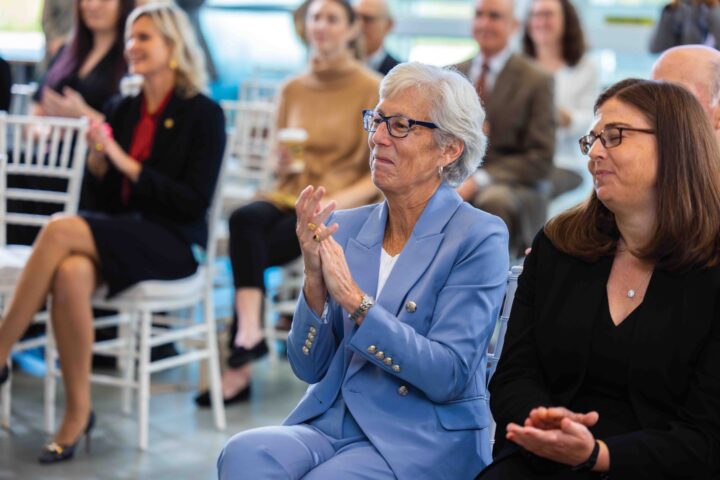Dean Jan Jurden clapping in an audience