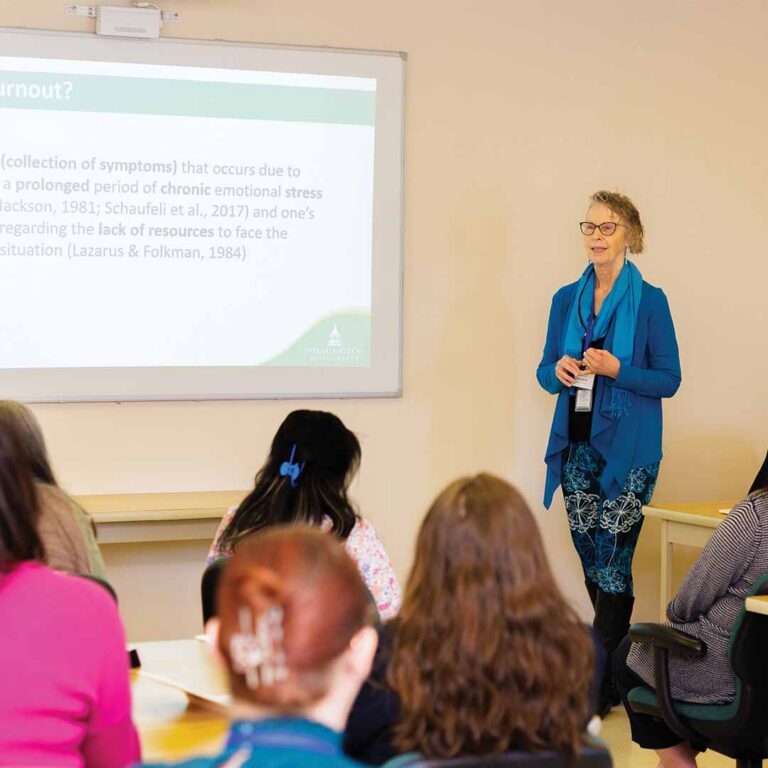 Dr. Debra L. Berke teaching in a classroom