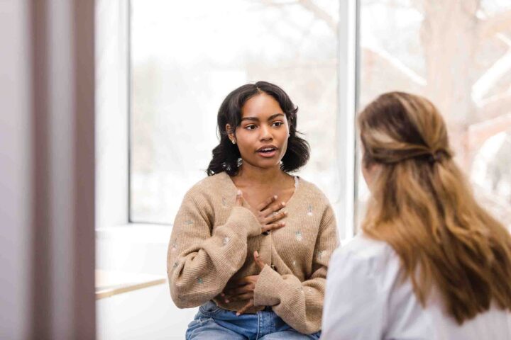 Young woman speaking to a doctor