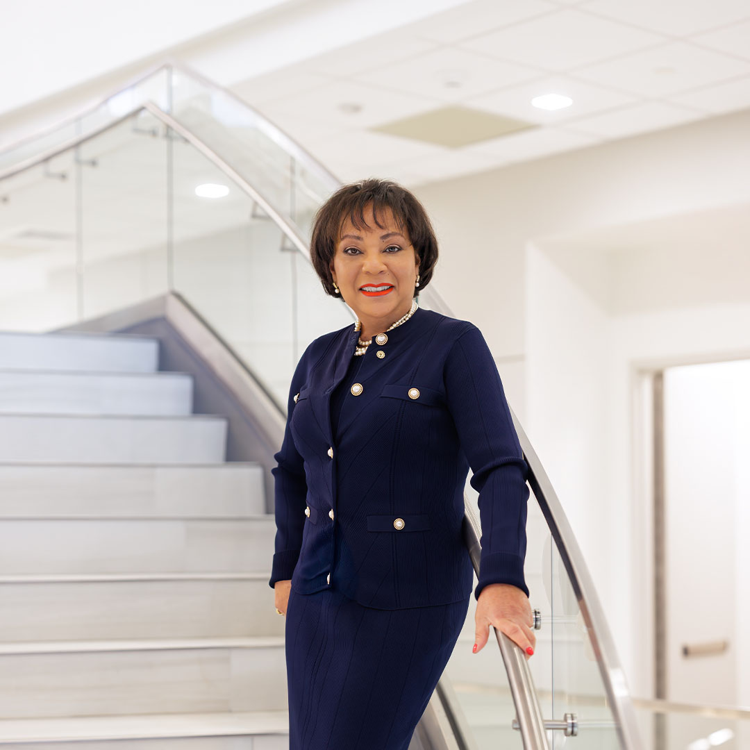 Dr. Laverne Harmon on stairs of new Wilmington University School of Law building.