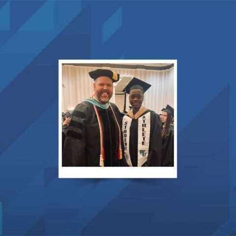 Dr. Matt Wilson and a student photographed together at commencement.