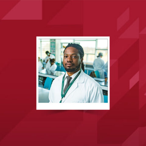 A polaroid style photo of Dr. Muldrow in a lab.