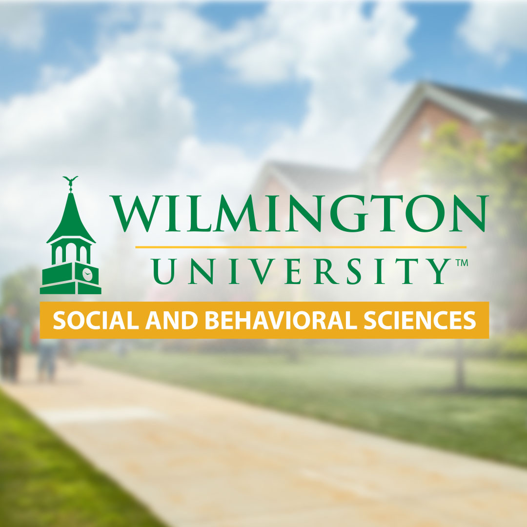 The College of Social and Behavioral Sciences logo overlayed on top of a blurred photo of the Wilmington University campus.
