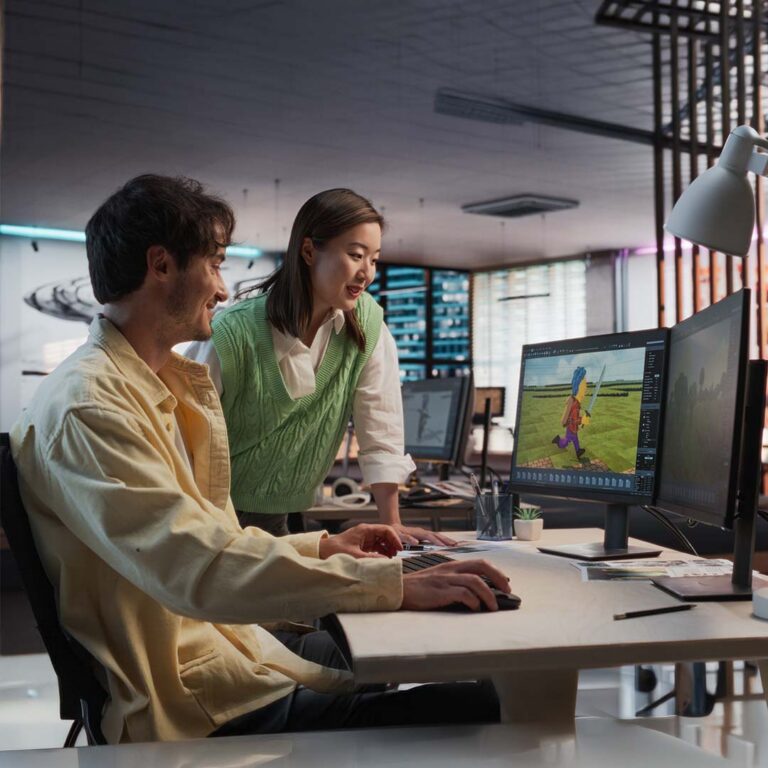 Game development and animation interns working in a creative office.