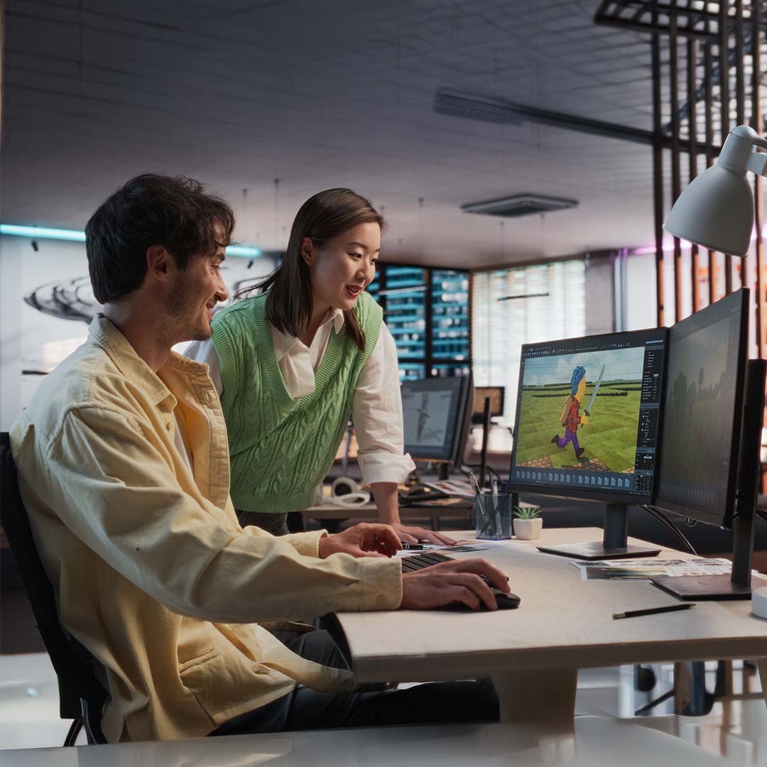 Game development and animation interns working in a creative office.