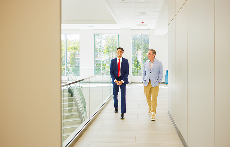 Jonathon Taylor and Mike Nestor walking halls of the Farnan School of Law.