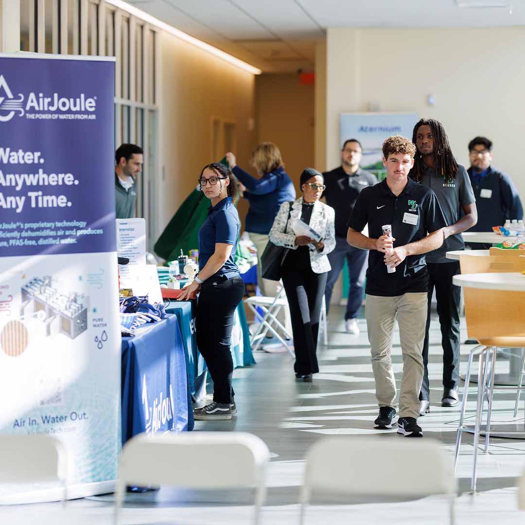 COSE Career Fair attendees meeting employers.