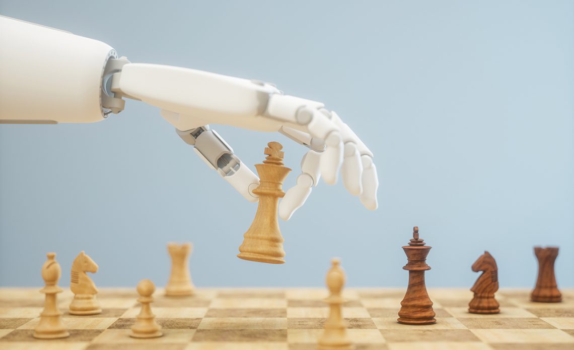 A robot hand plays chess