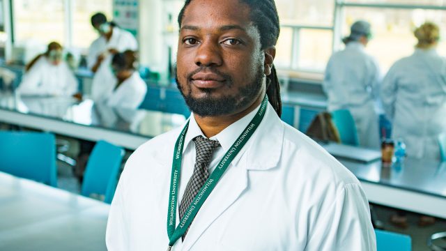 Dr. Muldrow in labcoat