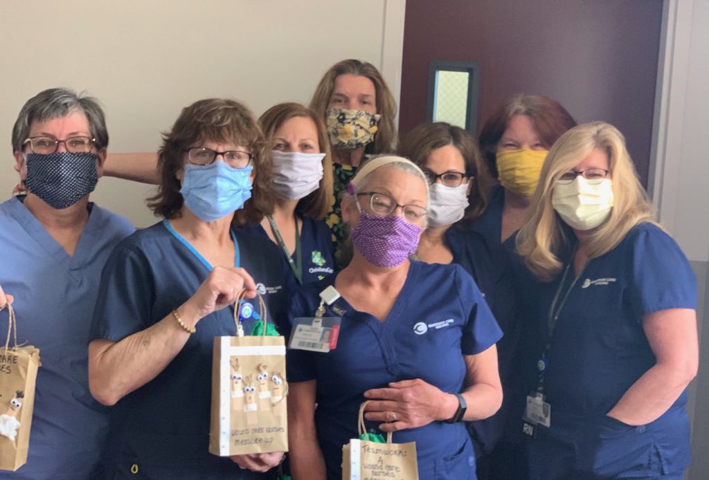 Nurses hold their WilmU care packages
