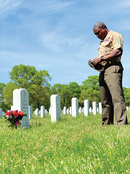 Soldier at father's gravesite
