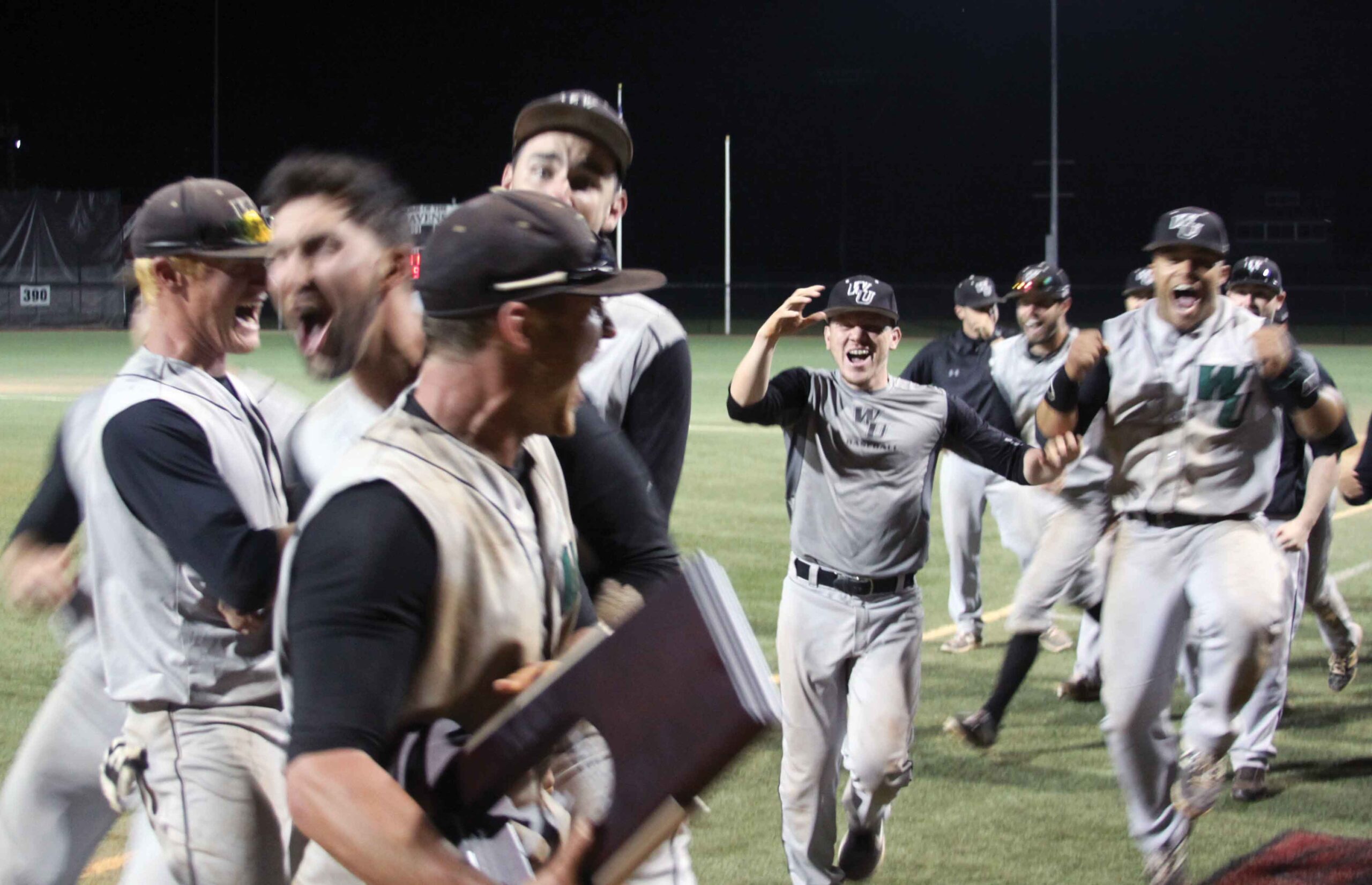 Baseball players cheering in excitement
