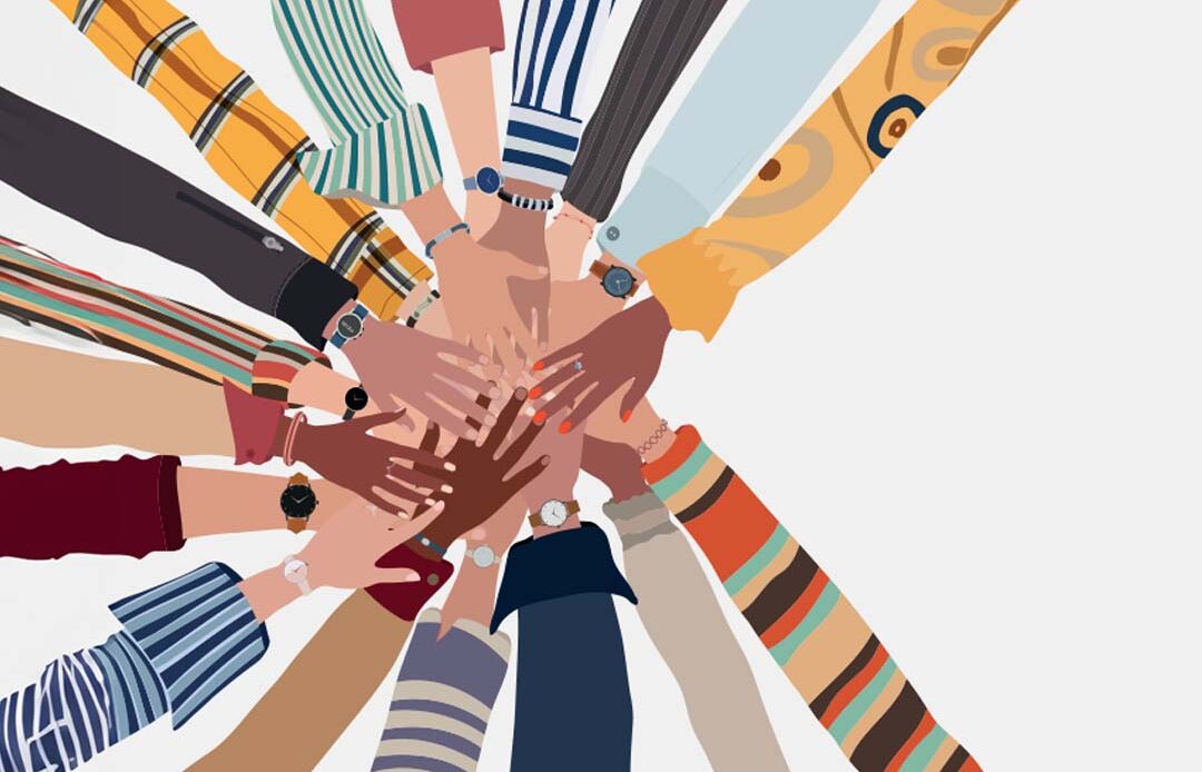 A diverse group of hands overlapping in the center, forming a circle. Each arm is dressed in different colorful sleeves, showcasing various patterns, stripes, and designs. The skin tones of the hands vary, symbolizing unity and teamwork.