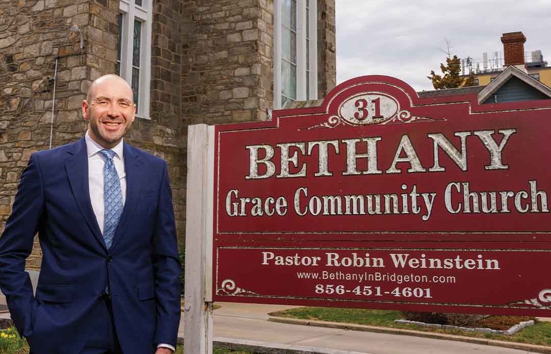 Dr. Robin Weinstein in front of his church.