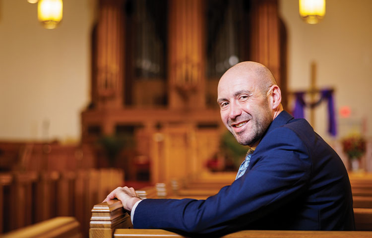 Dr. Robin Weinstein sitting in church.